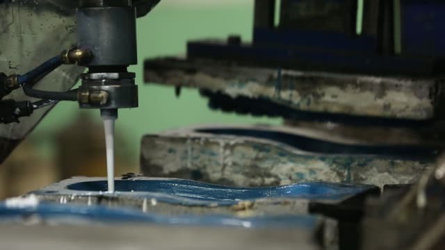 CU, a worker operates a machine that molds polyurethane into shoe soles at a Virola Shoes Pvt. manufacturing facility in Agra, Uttar Pradesh, India, on Thursday, June 22, 2017